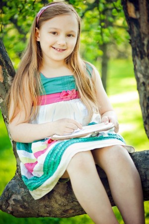 a girl doing crafts outside