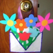 envelope filled with paper flowers