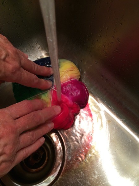 rinse shirt to remove dye