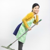 young woman holding a Swiffer style mop