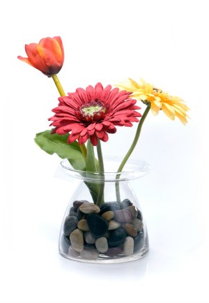 silk flowers in a glass vase