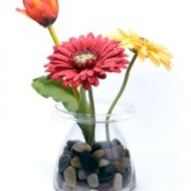silk flowers in a glass vase