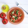 bowl of tomato and cucumber slices