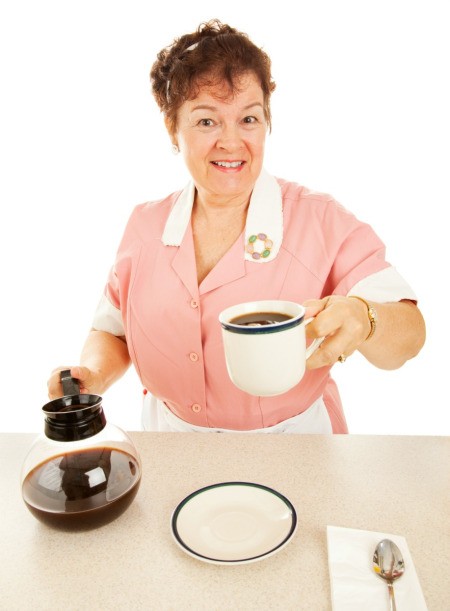 hot coffee pot placed on counter by waitress