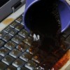 dark liquid spilled on laptop keyboard