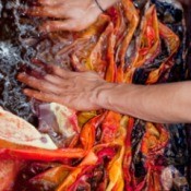 hands of someone dyeing cloth