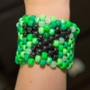 Beaded Minecraft Creeper Cuff - finished bracelet being worn