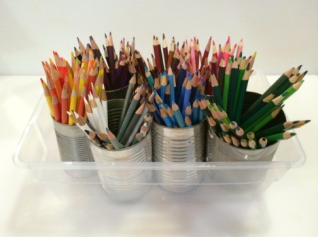 pencils separated by color in tin cans