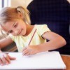 girl drawing while traveling on a train