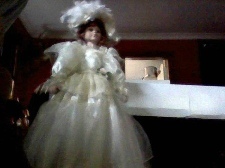 doll in fancy white dress with large hat