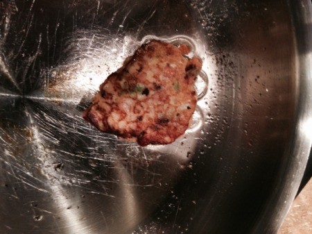 brown croquette in skillet