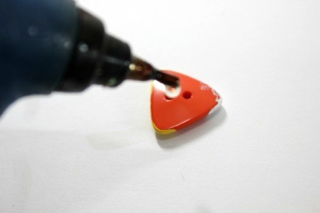 put glue on back of button