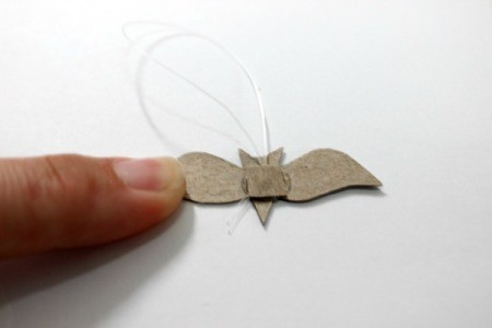 glue fishing line to back