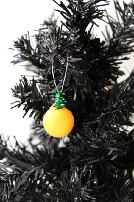 wooden pumpkin ornament in tree