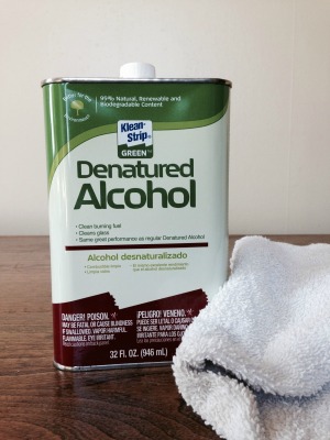 can of denatured alcohol and terrycloth rag