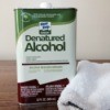 can of denatured alcohol and terrycloth rag