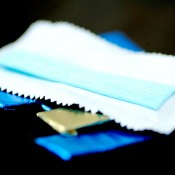 unwrapped gum on top of several foil wrapped pieces