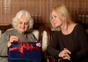 daughter giving mother a gift