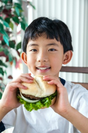 Boy Eating a Burger