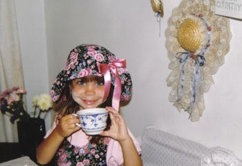 closeup of little girl dressed for a tea party