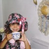 closeup of little girl dressed for a tea party