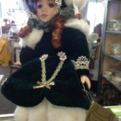 doll in fancy white dress with large hat
