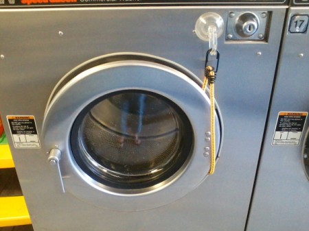 front load washer with bungee cord keeping it open