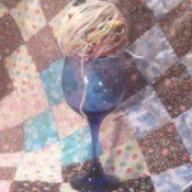 Scrap Yarn Ball - ball of yarn in stem glass