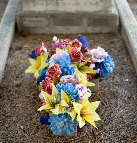 grave cross made of artificial flowers