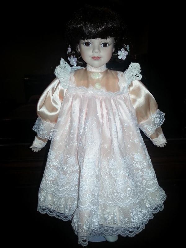 doll wearing pinafore dress