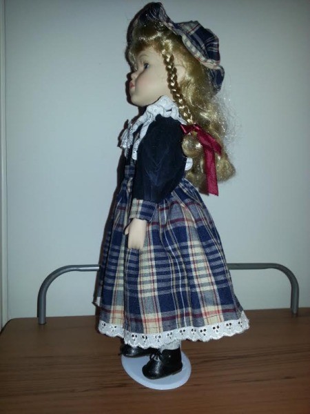 side view of doll in plaid dress
