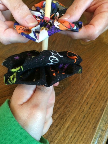 put yo yos onto dowel 2