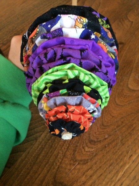 put yo yos onto dowel 5