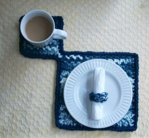 blue and white ombre crochet mat with cup and small plate