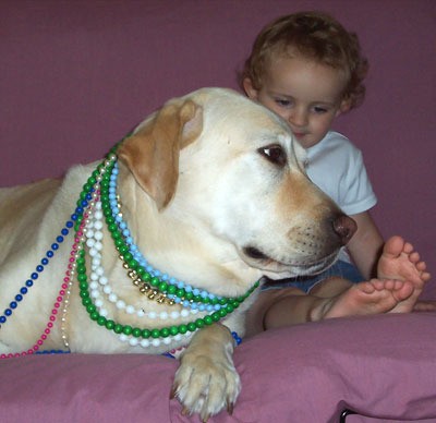 dog with beads and child