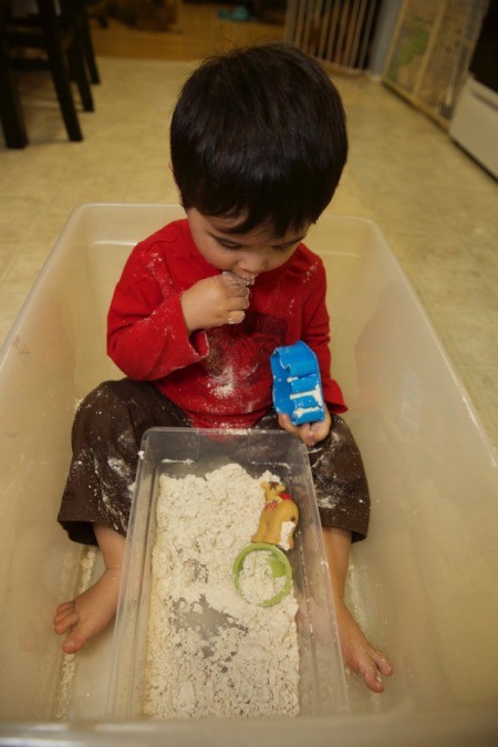 child tasting dough