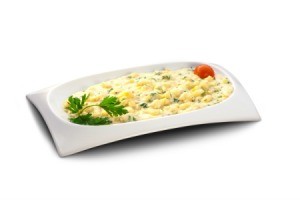 potatoes with cream and cheese on white platter with garnish