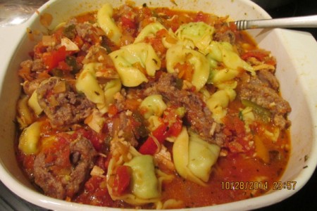 serving bowl with tortellini and sauce