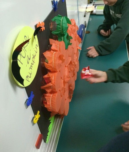 kids playing poke-a-pumpkin