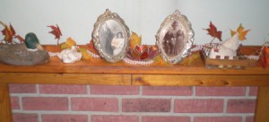 photos and decorations on mantle