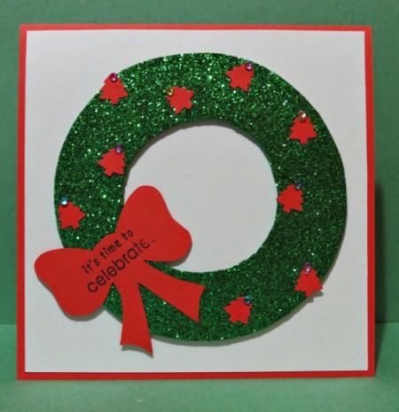 wreath with message on bow and rhinestones added to tree tops