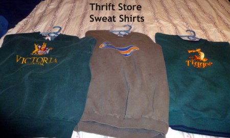 Three sweatshirts purchased at the thrift store.