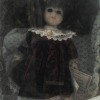 A Dandee porcelain doll in a box.
