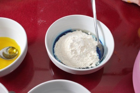 adding flour to bowls