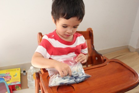 child mixing ingredients