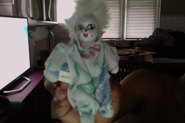 clown doll wearing blue and green