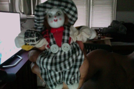 doll wearing a black and white check outfit