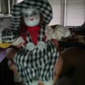 doll wearing a black and white check outfit