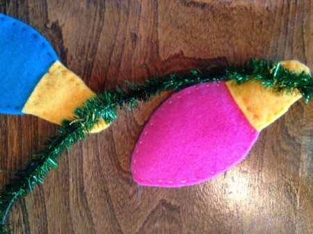 backside of same two bulbs sewn to tinsel