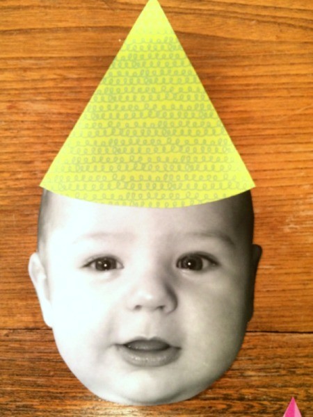 Baby Faces Birthday Banner - hat on face
